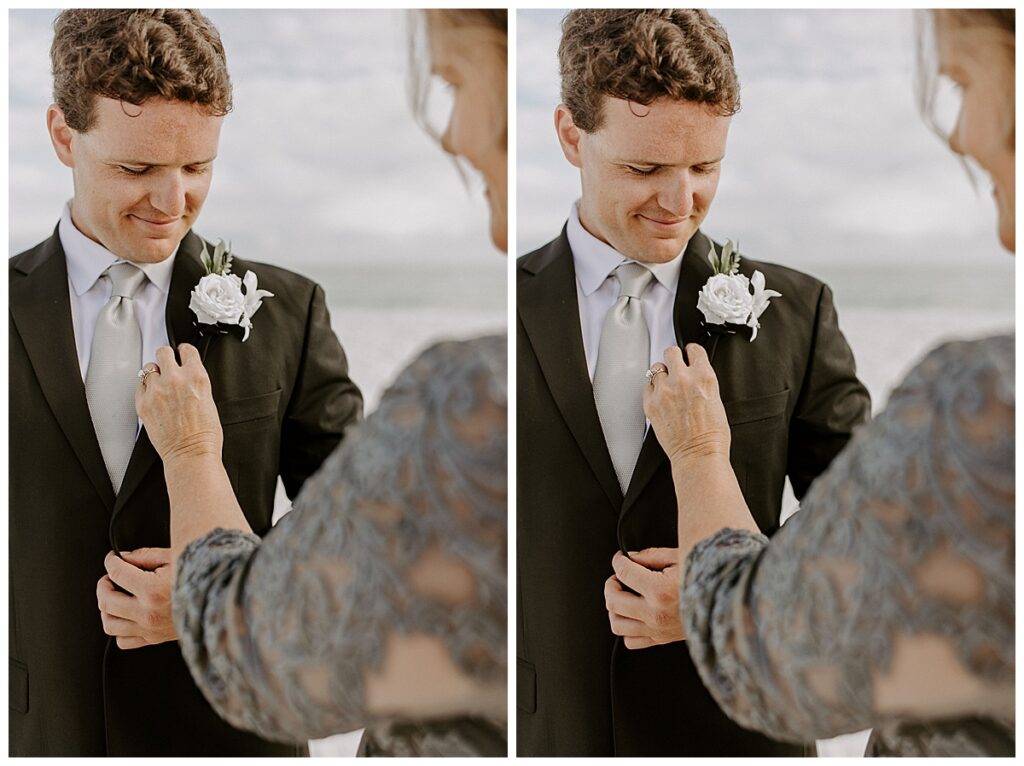 mom pinning boutonniere on groom