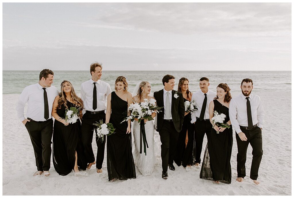 full wedding party on beach