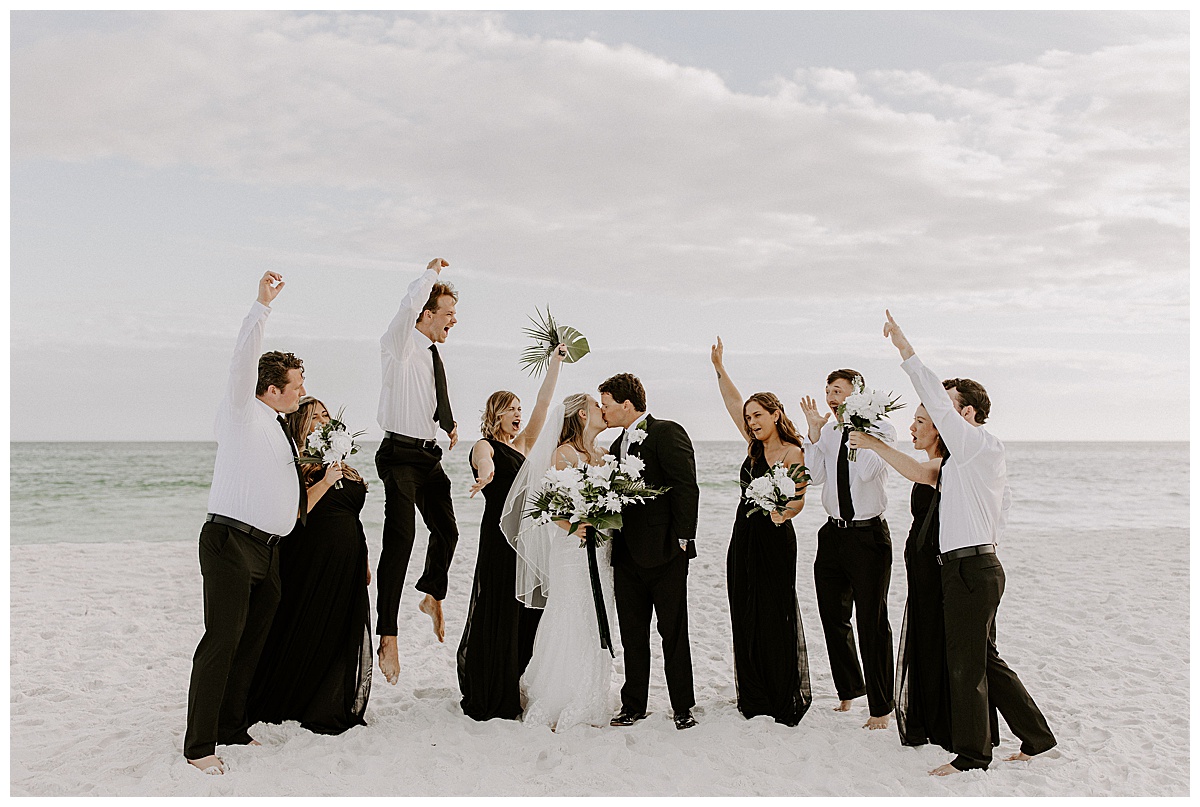 full wedding party on beach