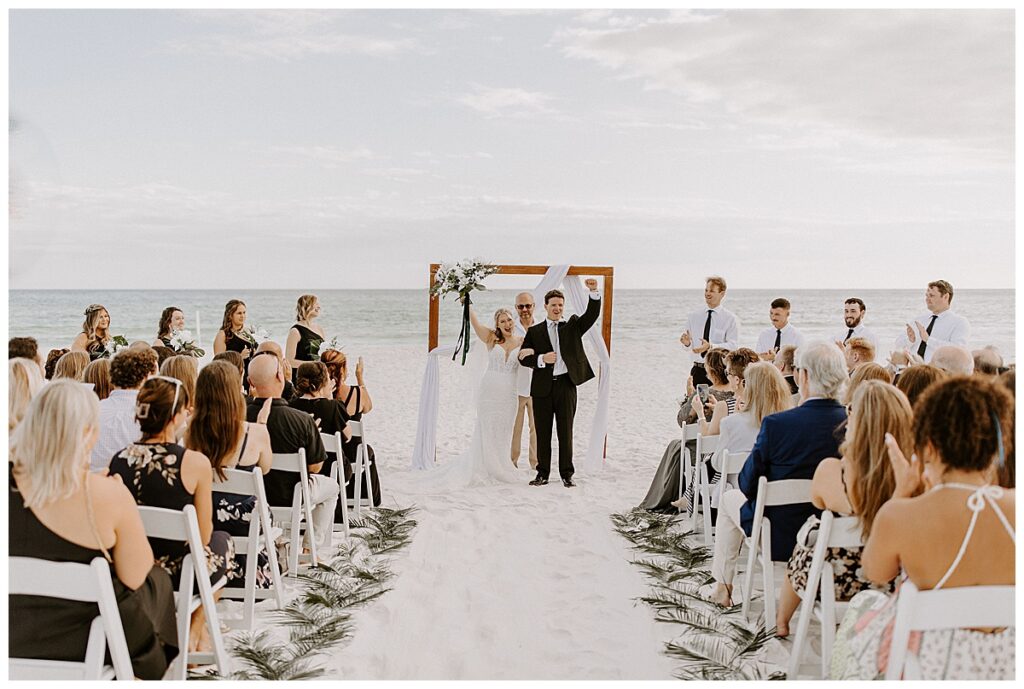 bride and groom cheering