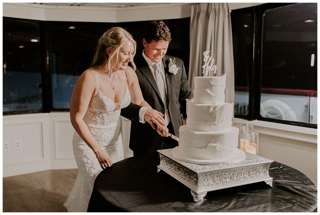 bride and groom cutting cake
