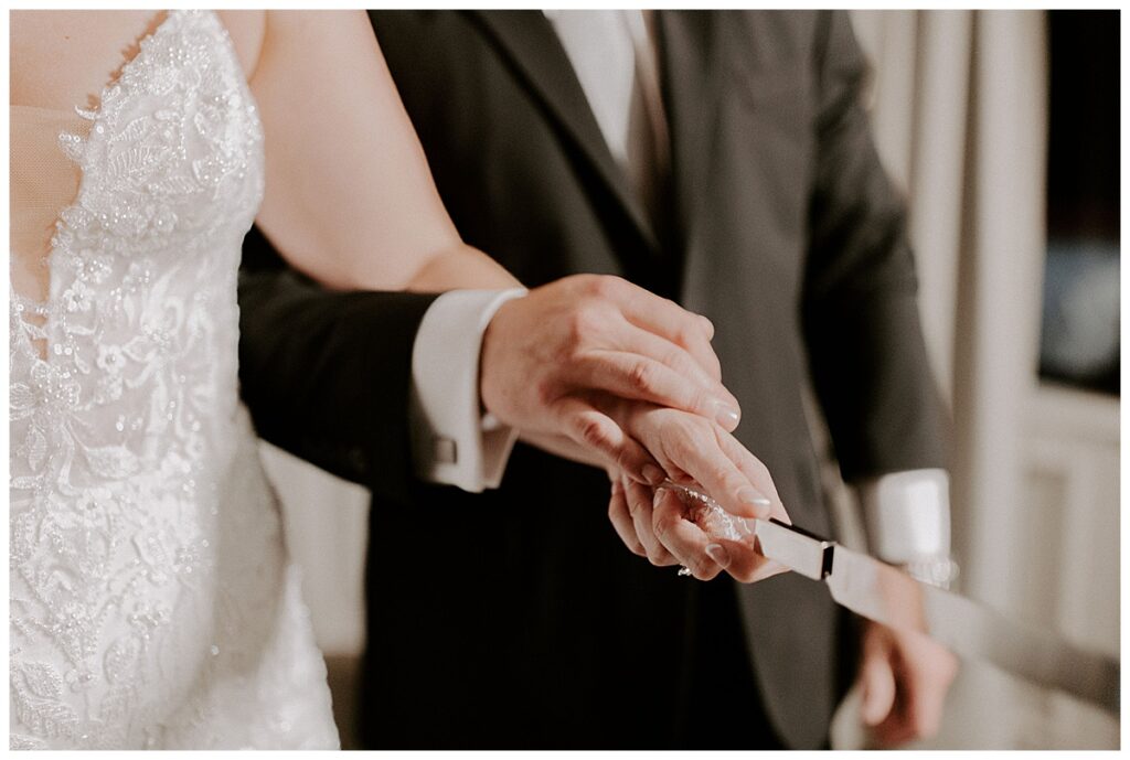 bride and groom cutting cake