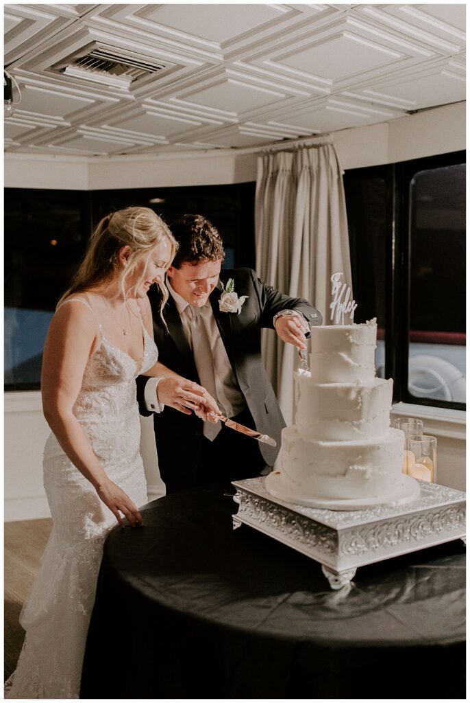 bride and groom cutting cake