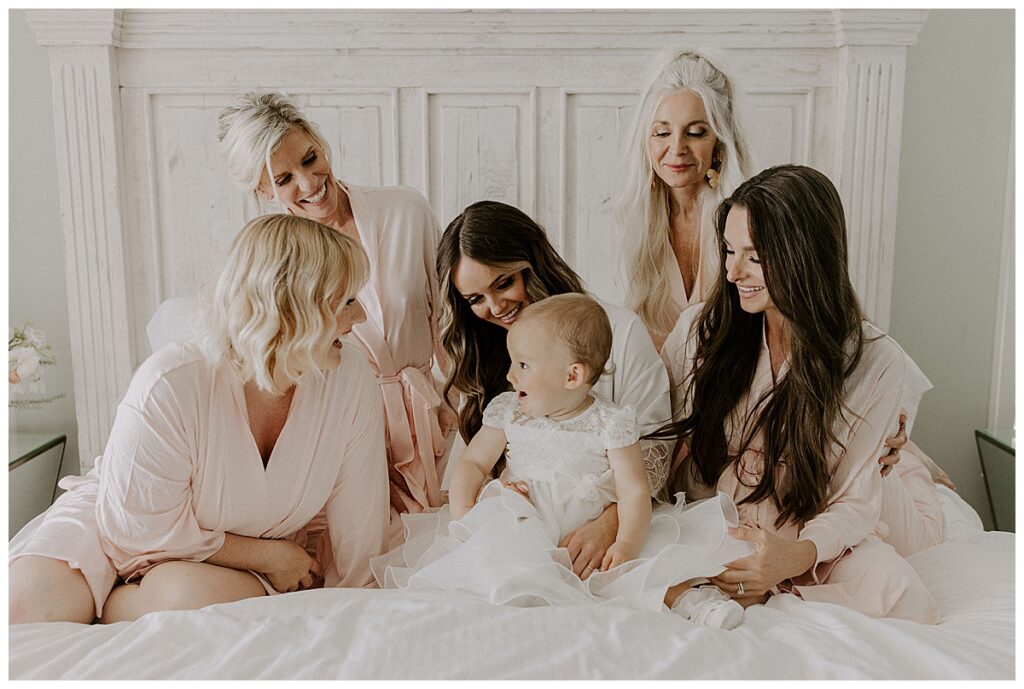 bride and family members on bed