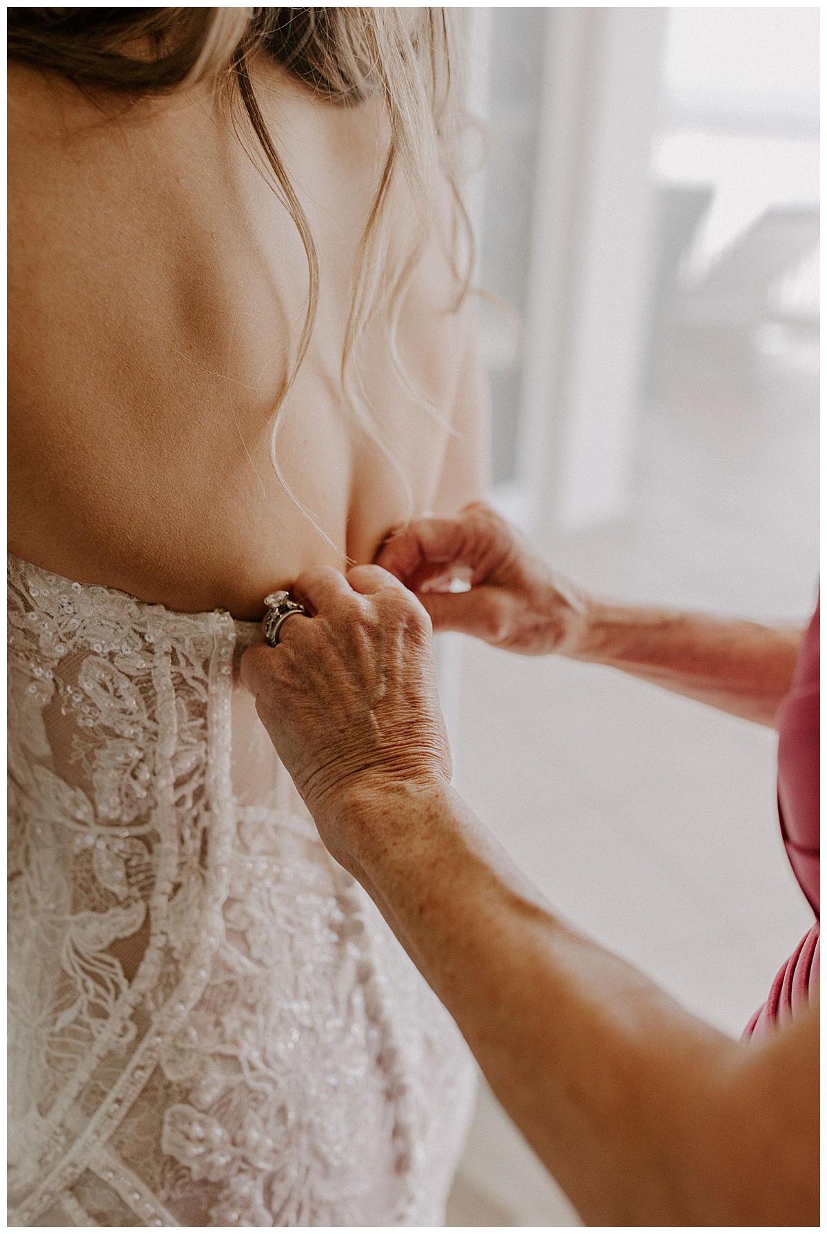 bride's mom zipping dress