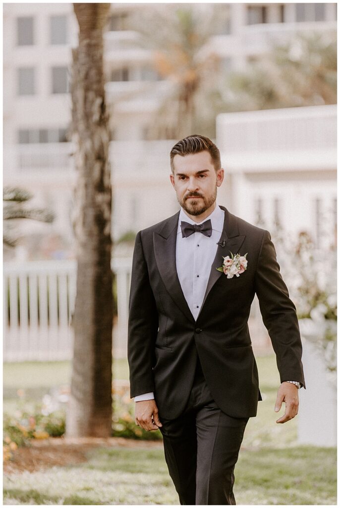 groom walking down aisle