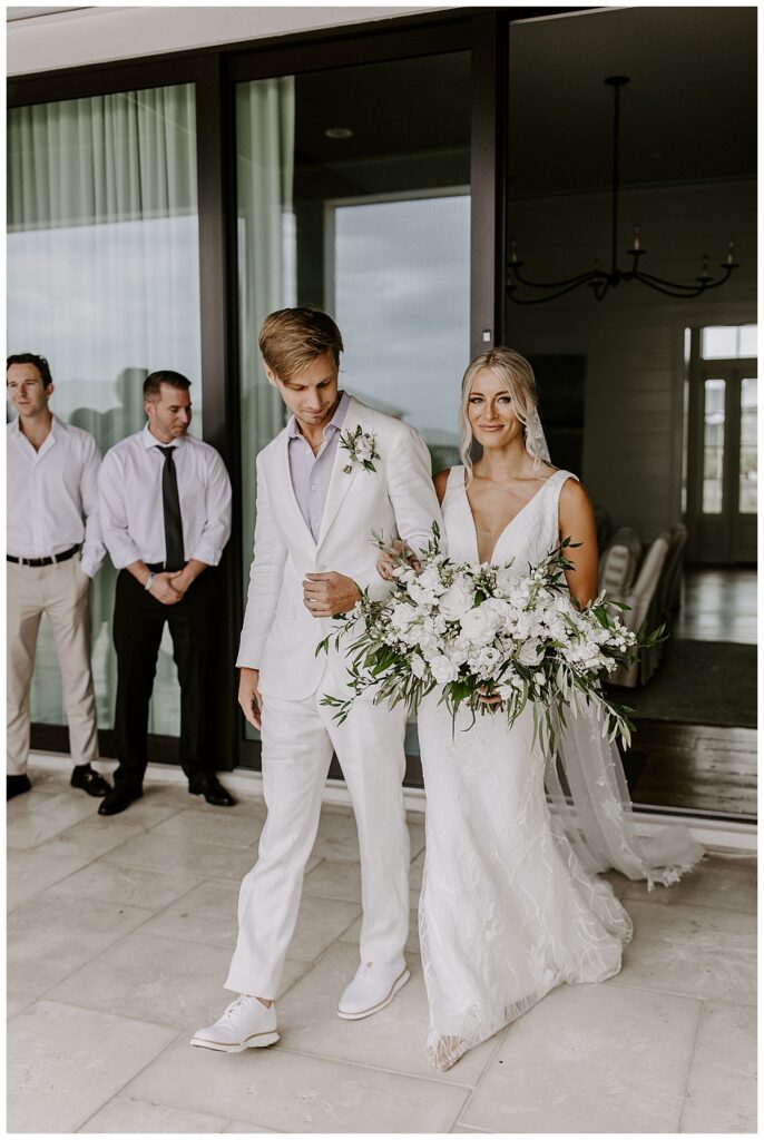 bride and groom walking down aisle