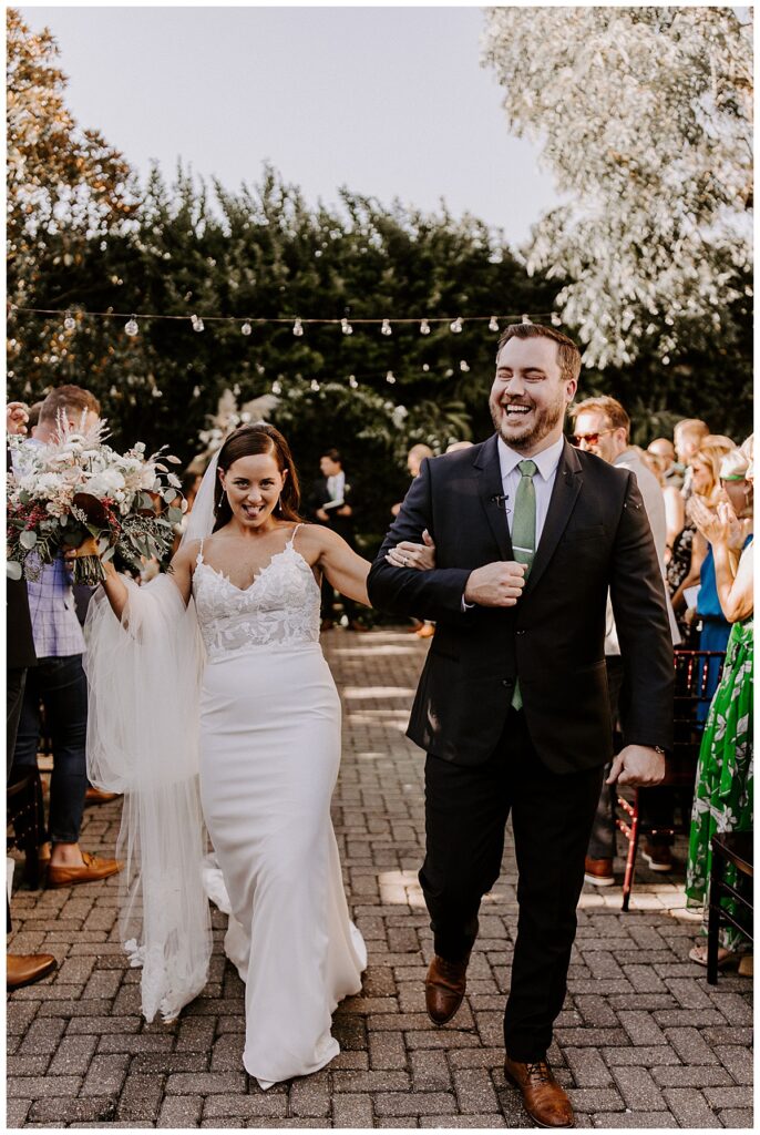 Bride and groom walking down the aisle
