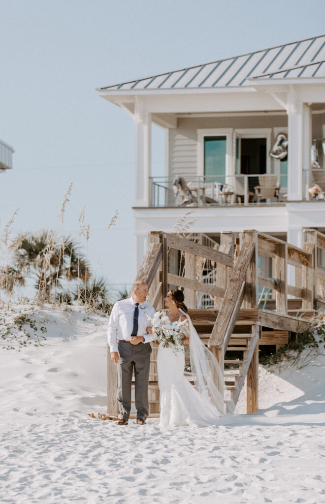 bride and dad walk down the aisle