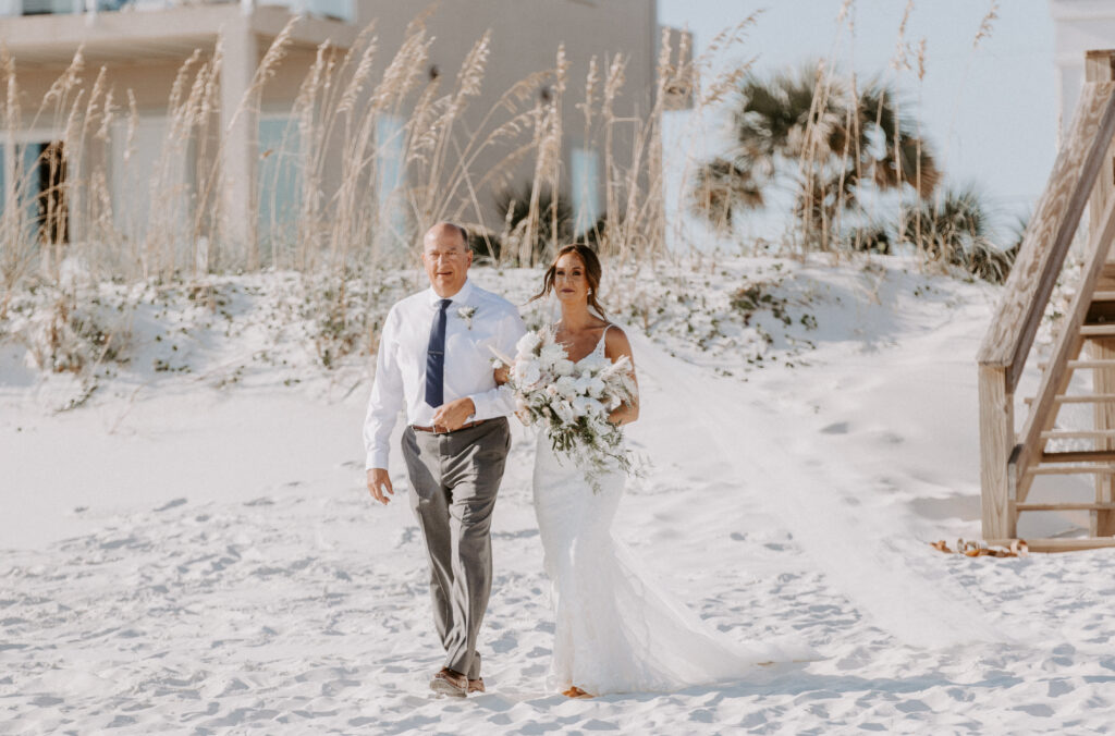 bride and dad walk down aisle