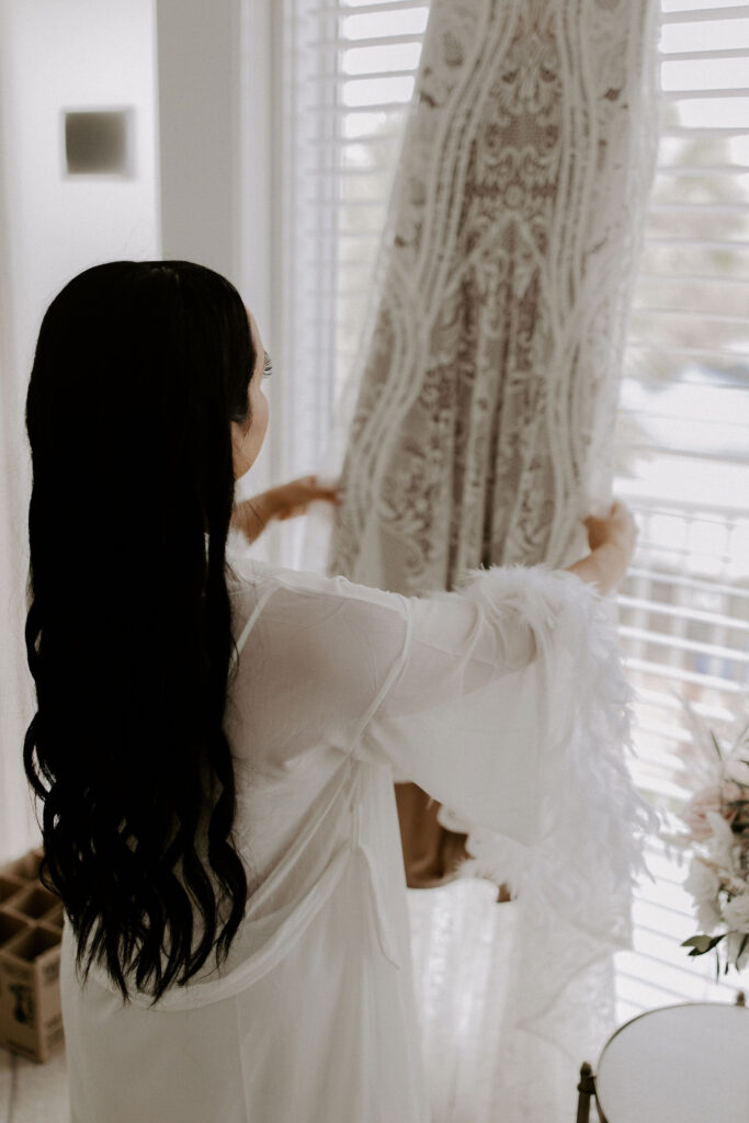 bride touching dress