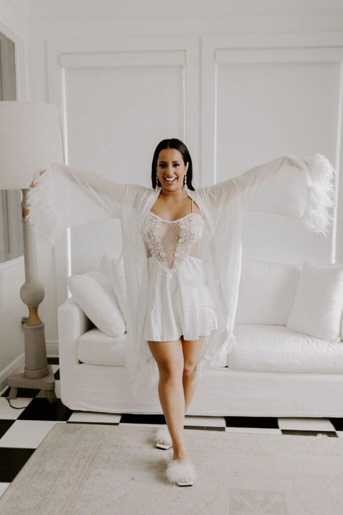 Bride in white getting ready outfit