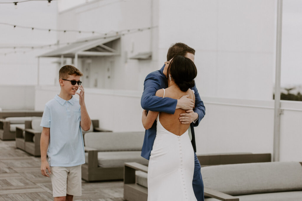 first look with bride and brothers