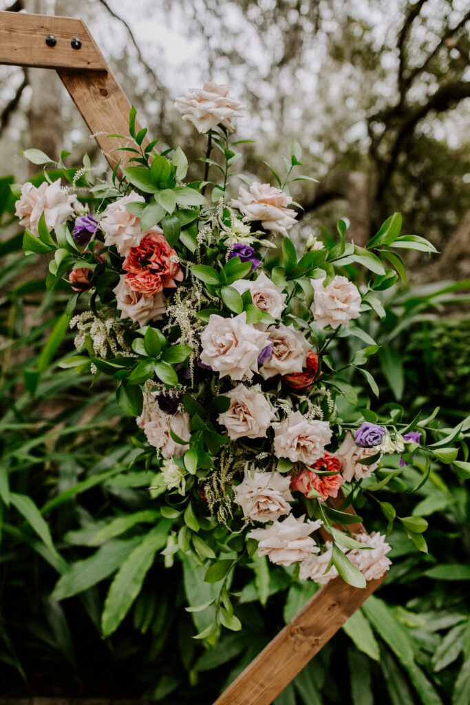 A closeup of the arbor at the Mill Pond Estate wedding venue, decorating with a floral arrangement.