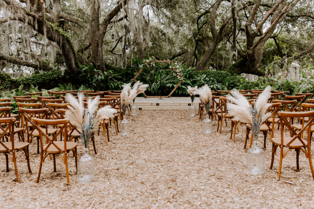 The ceremony location at Mill Pond Estate, with the arbor on a platform in front of chairs.