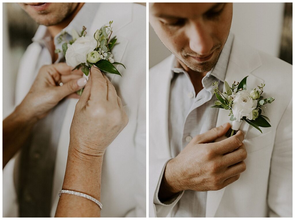 groom touching boutonniere
