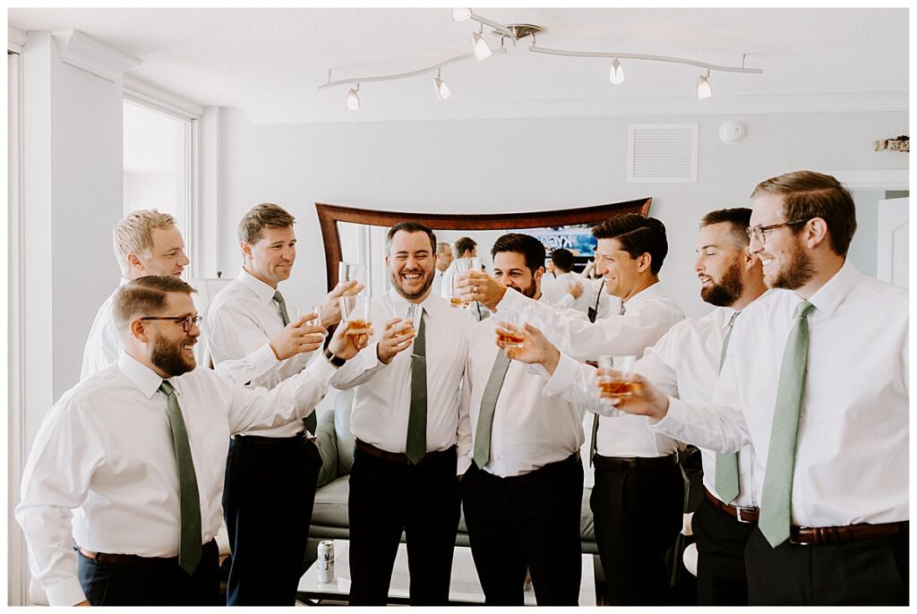 Groom and groomsmen giving a toast