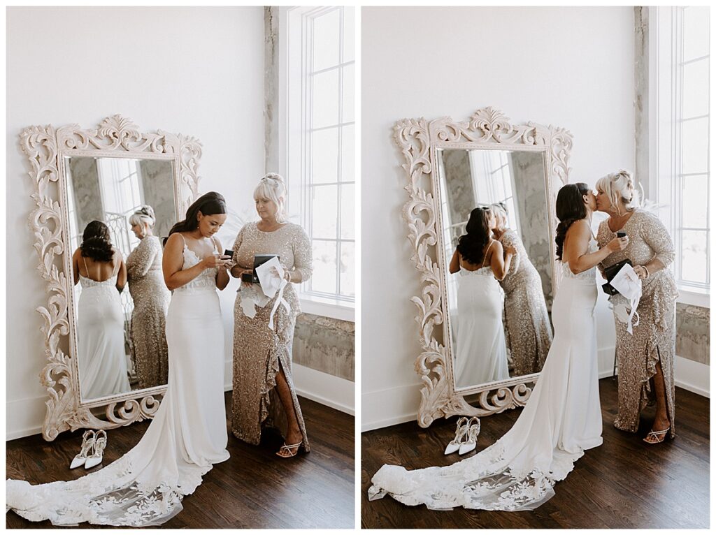 Bride's mom giving her a gift/mom and bride kissing cheeks