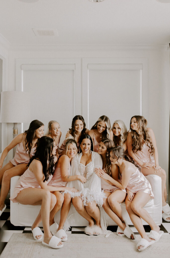 Bride with bridesmaids on couch