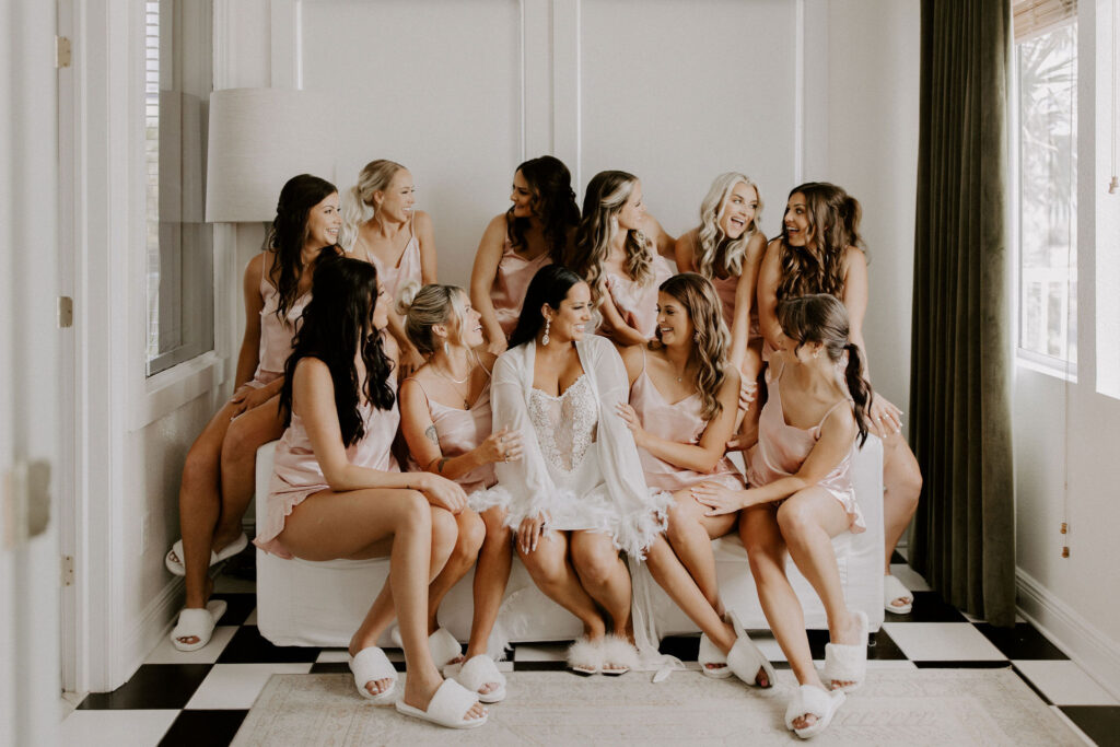 Bride with bridesmaids on couch