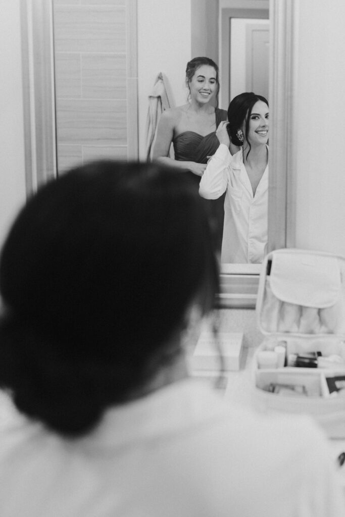 bride looking at herself in mirror
