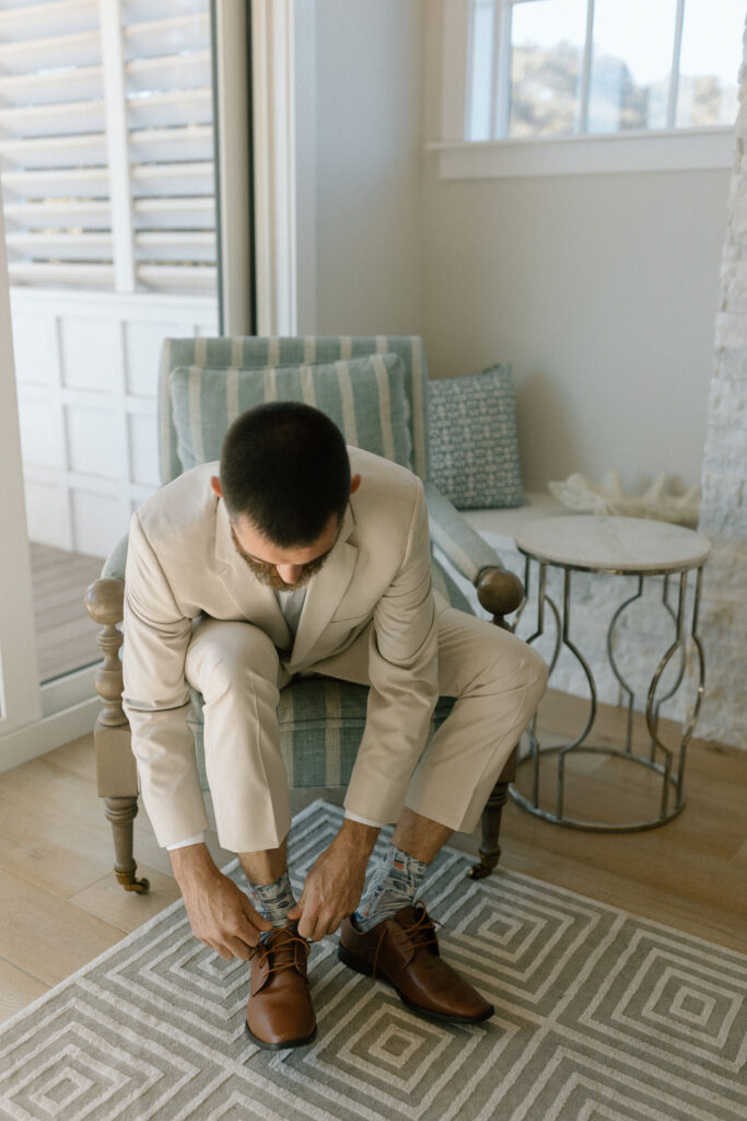 Groom putting on shoes