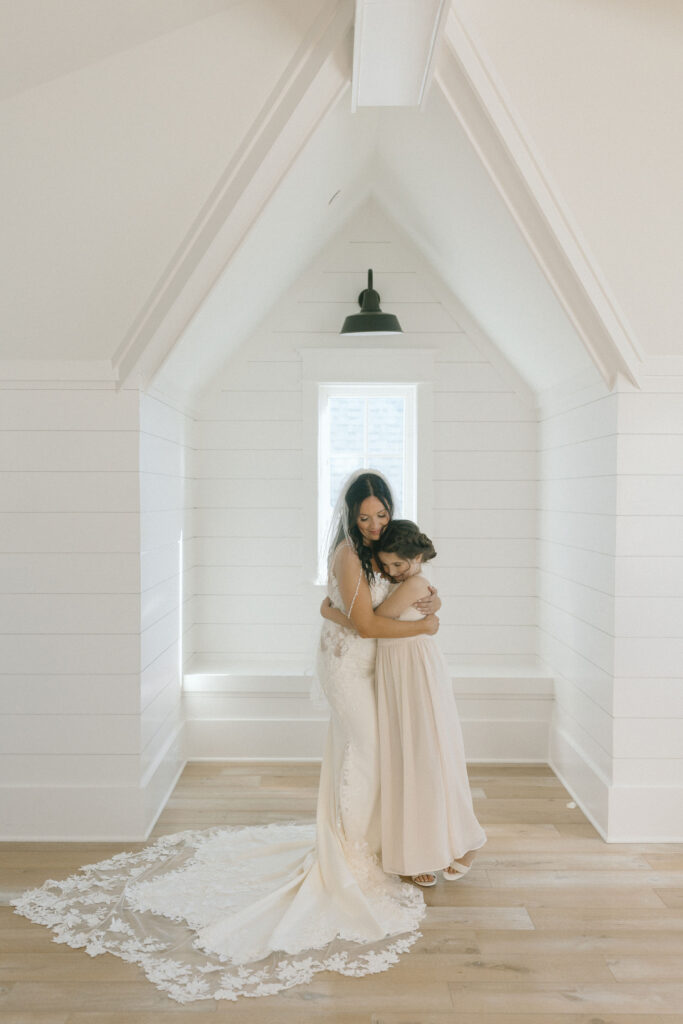 Bride and daughter hugging