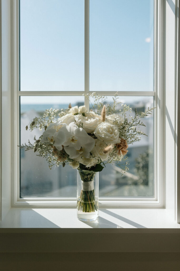 Bridal bouquet framed in a window