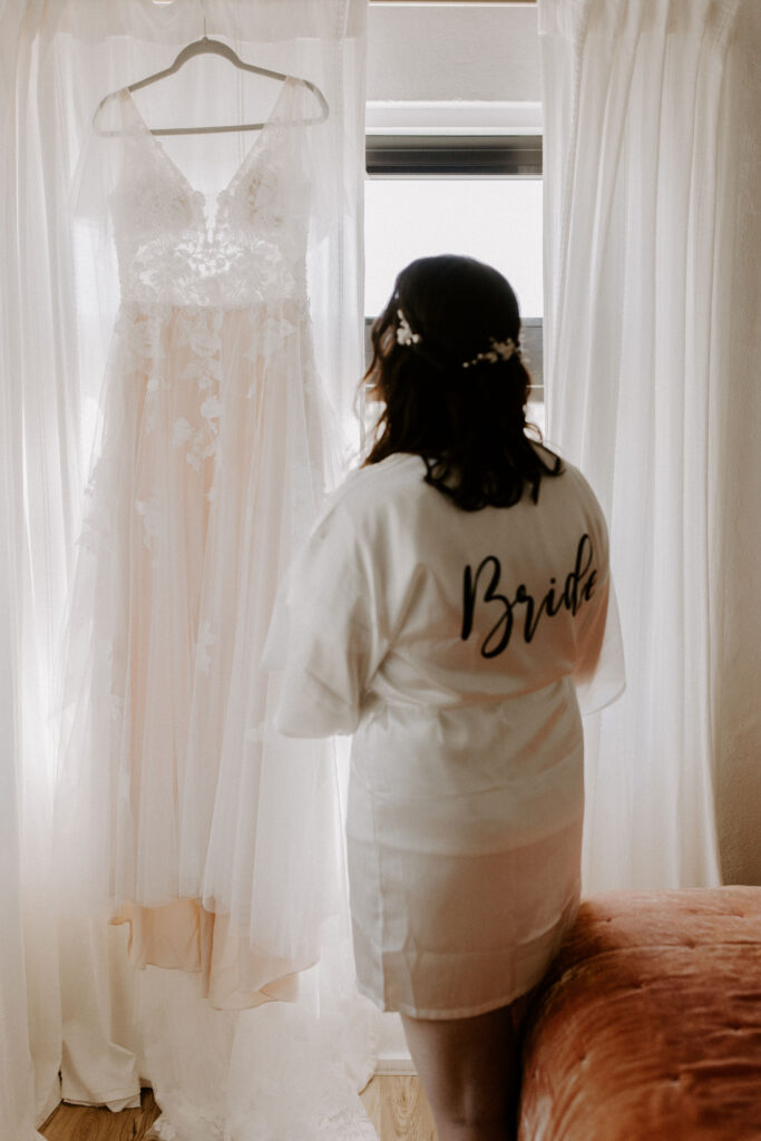 Bride looking at her wedding dress