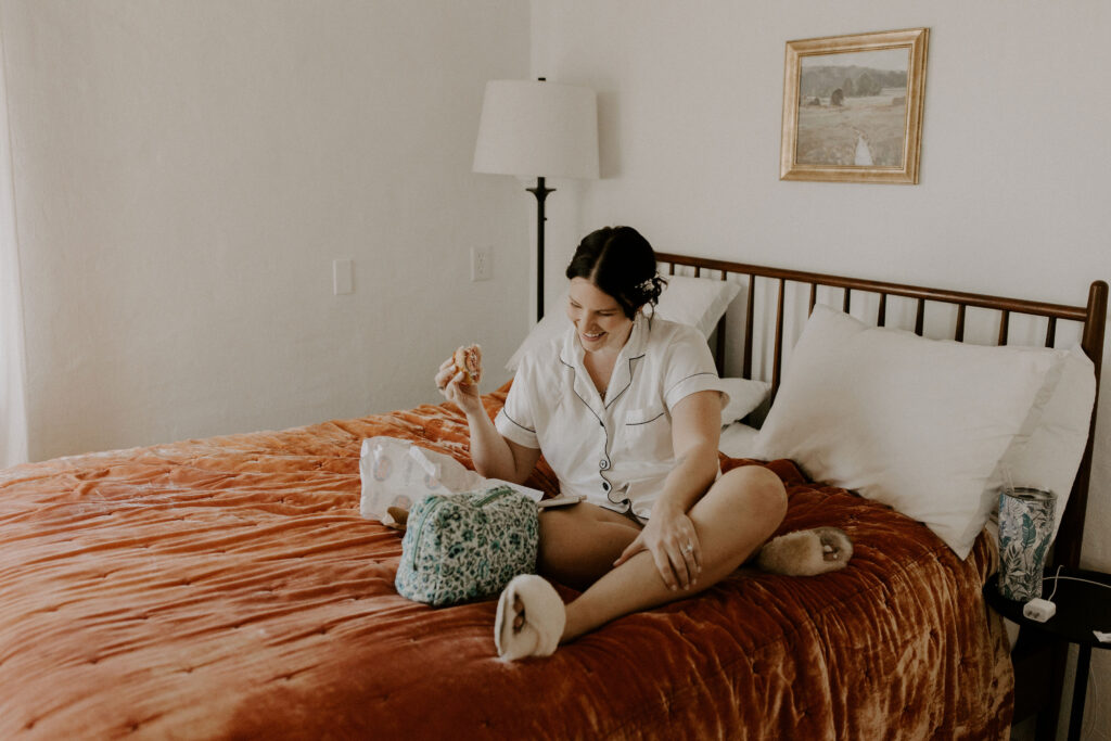 Bride sitting on the bed at her st augustine elopement