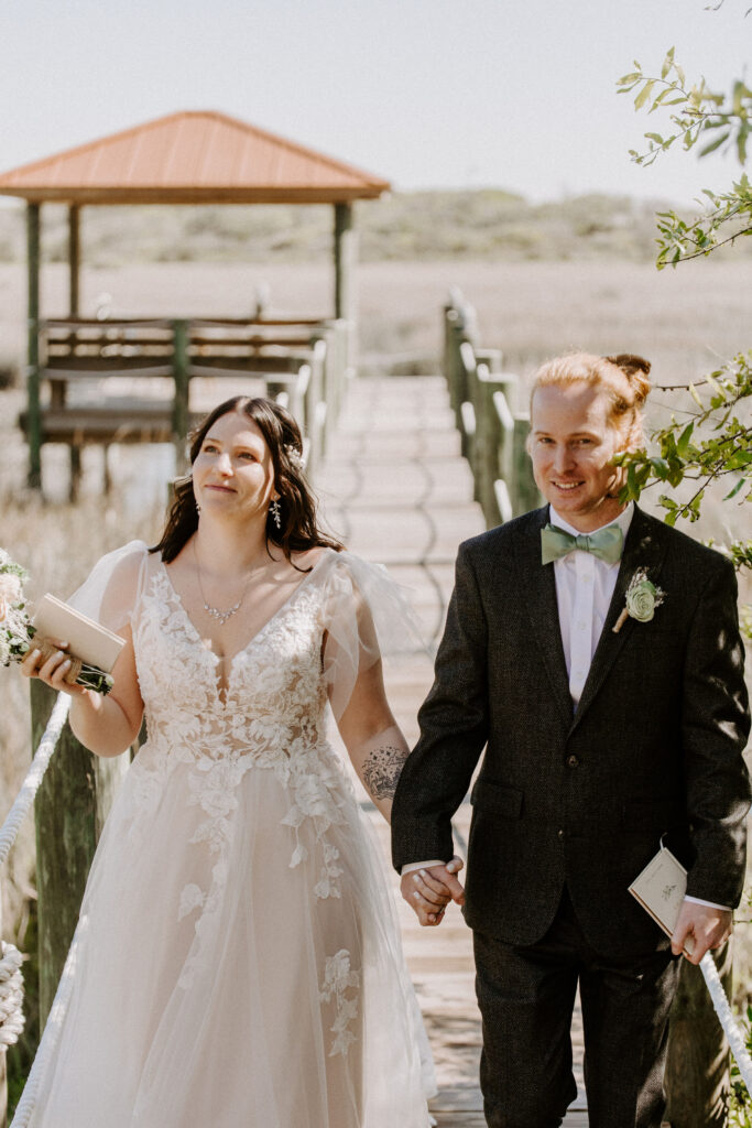 Couple looking at their friends and family after their wedding ceremony